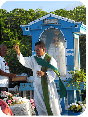 A priest blesses the congregation. A priest blesses the congregation.