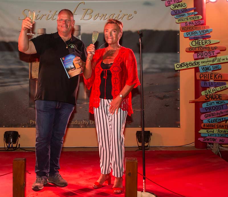 Jannet Butter presents the first copy of her new book to Eric Geitman. Jannet Butter presents the first copy of her new book to Eric Geitman.